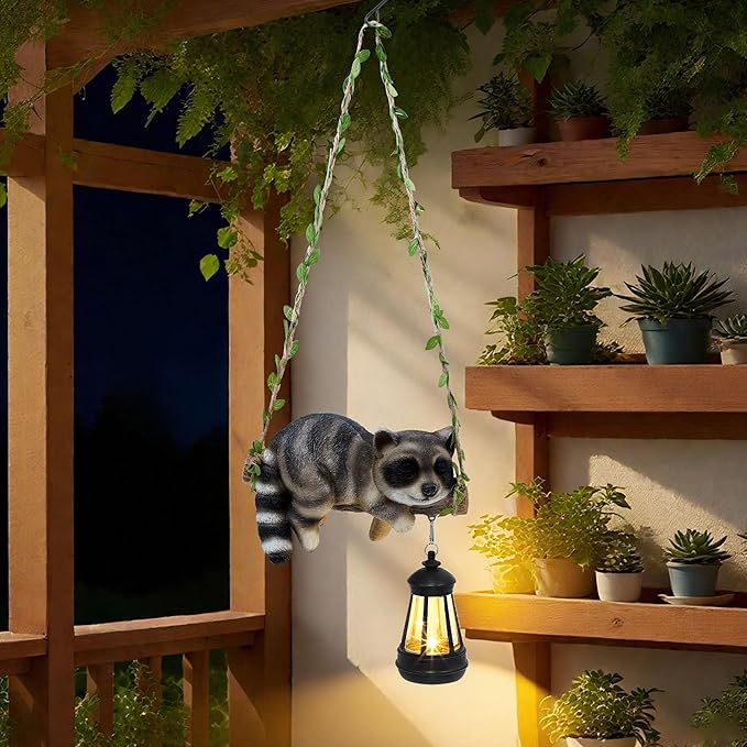 Solar Lighted Garden Outdoor Statue, 20.1" H Hanging Swing Lying with A Sleeping Raccoon and A LED Lantern, Resin Animal Figurine Hanging Ornaments with Hook for Decoration & Gift